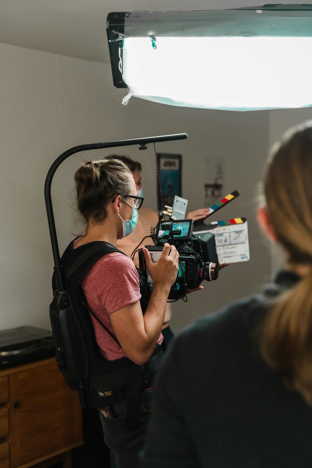 a woman with a camera in a room