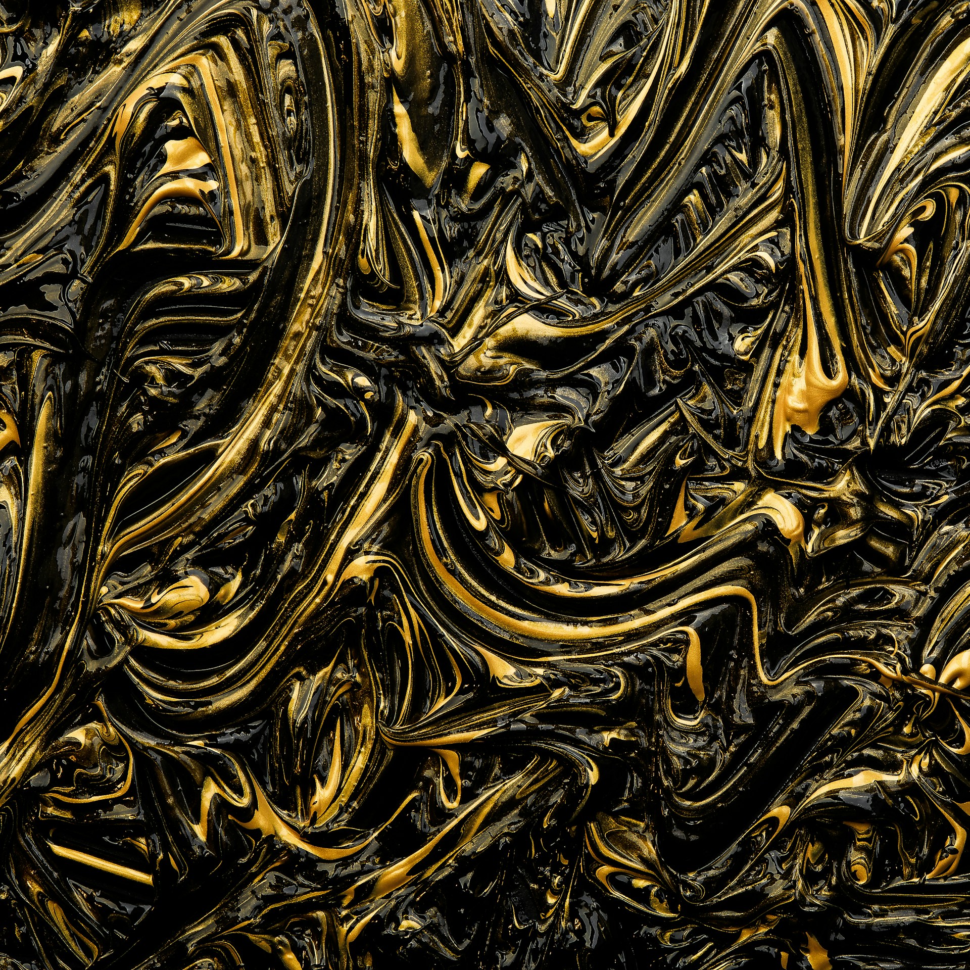 a close up of a black and gold background