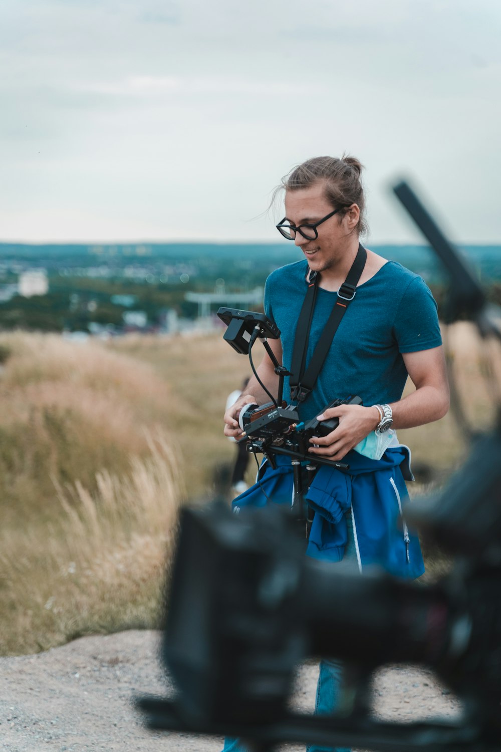 a man holding a camera in front of a camera