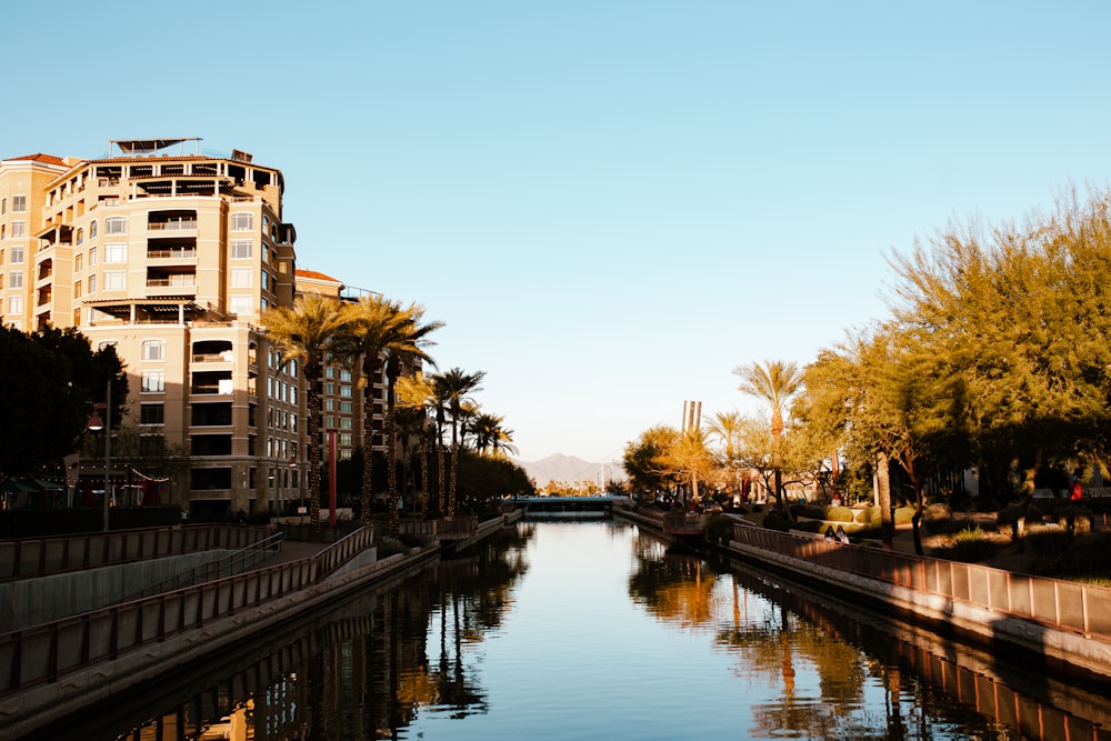 a river running through a city next to tall buildings