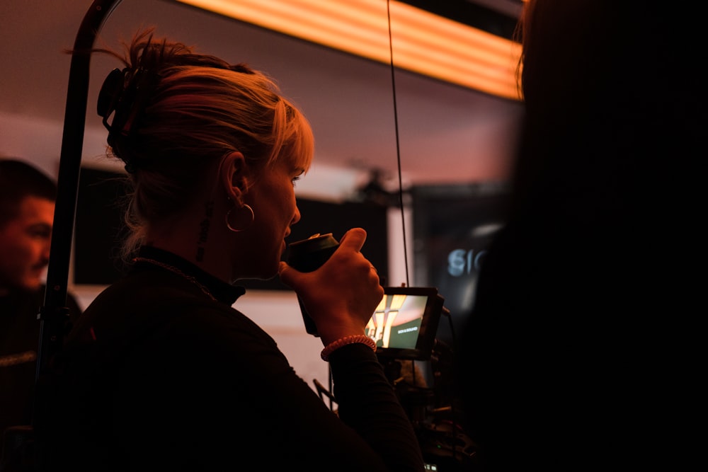 a woman is taking a picture of herself in the mirror