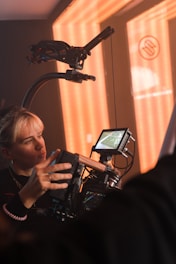 a woman standing in front of a camera