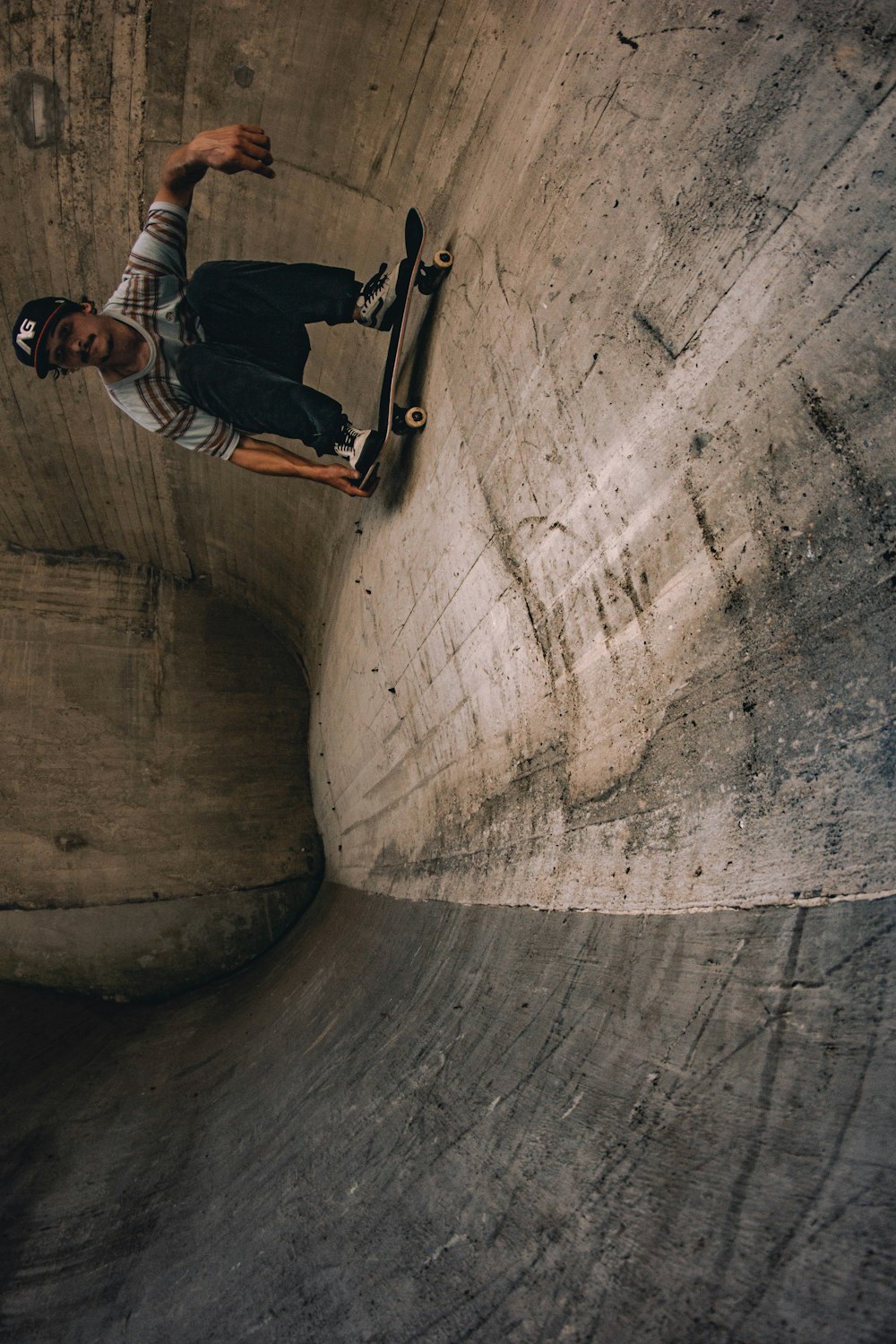 a man riding a skateboard up the side of a ramp