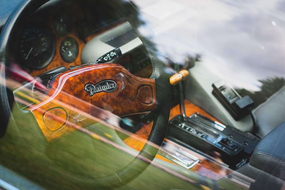 a close up of a steering wheel and dashboard of a car