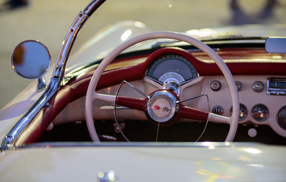 a close up of a steering wheel and dashboard of a car