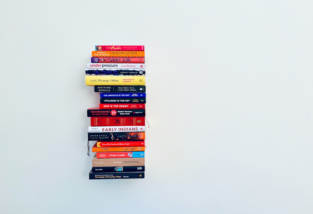 a stack of books sitting on top of each other