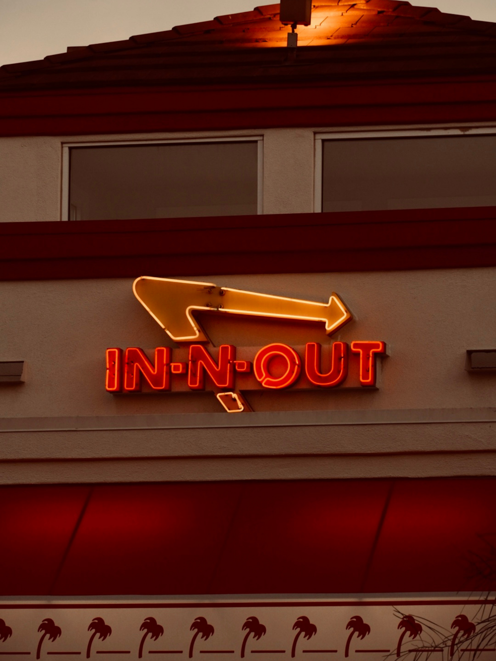 a neon sign on the side of a building