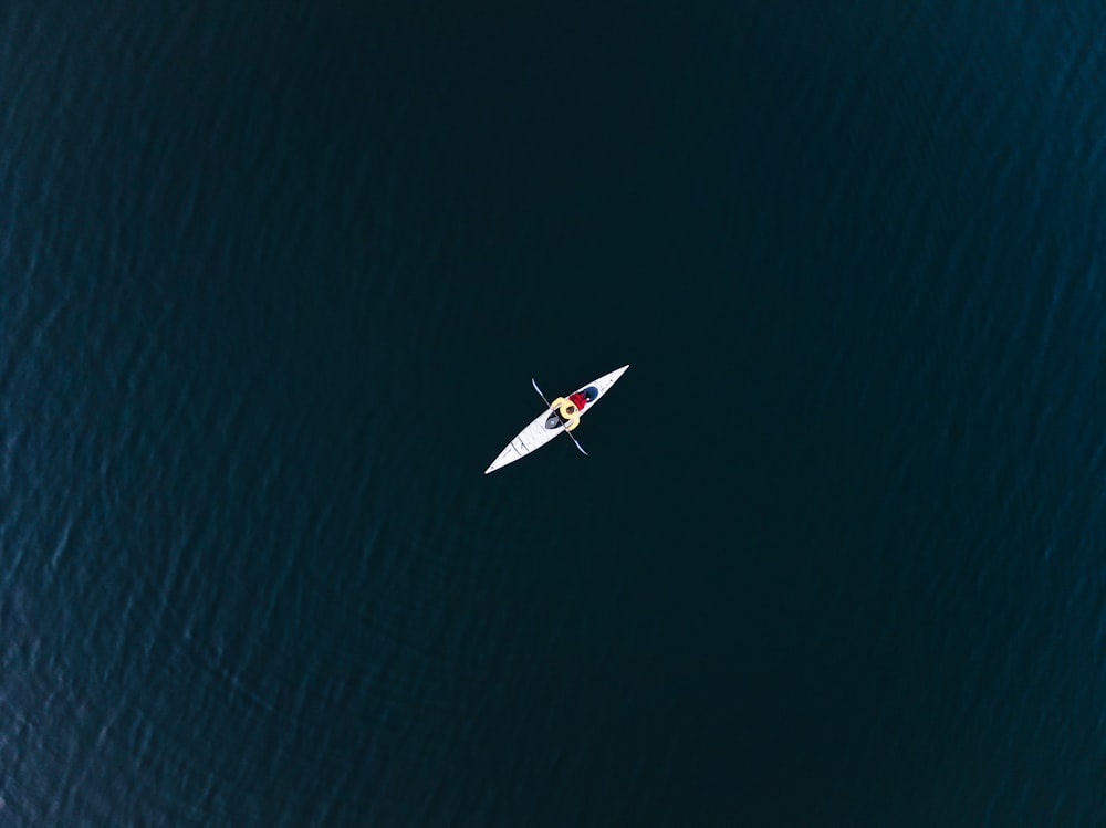 an aerial view of a person in a kayak