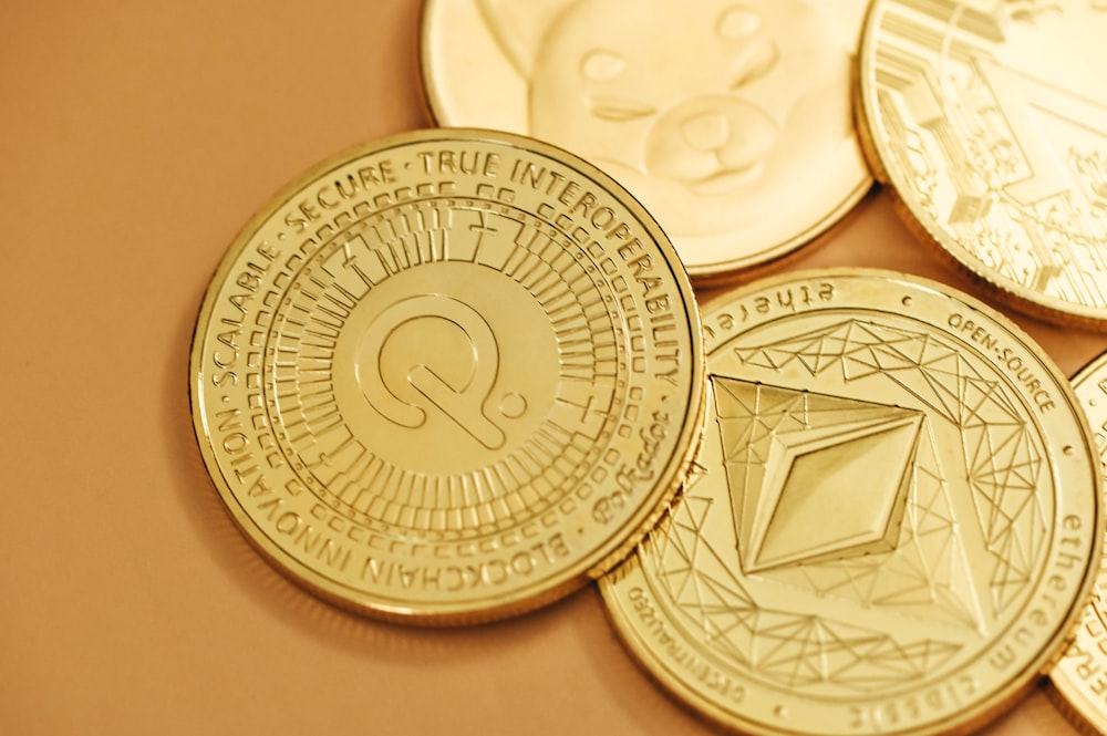 a pile of gold coins sitting on top of a table