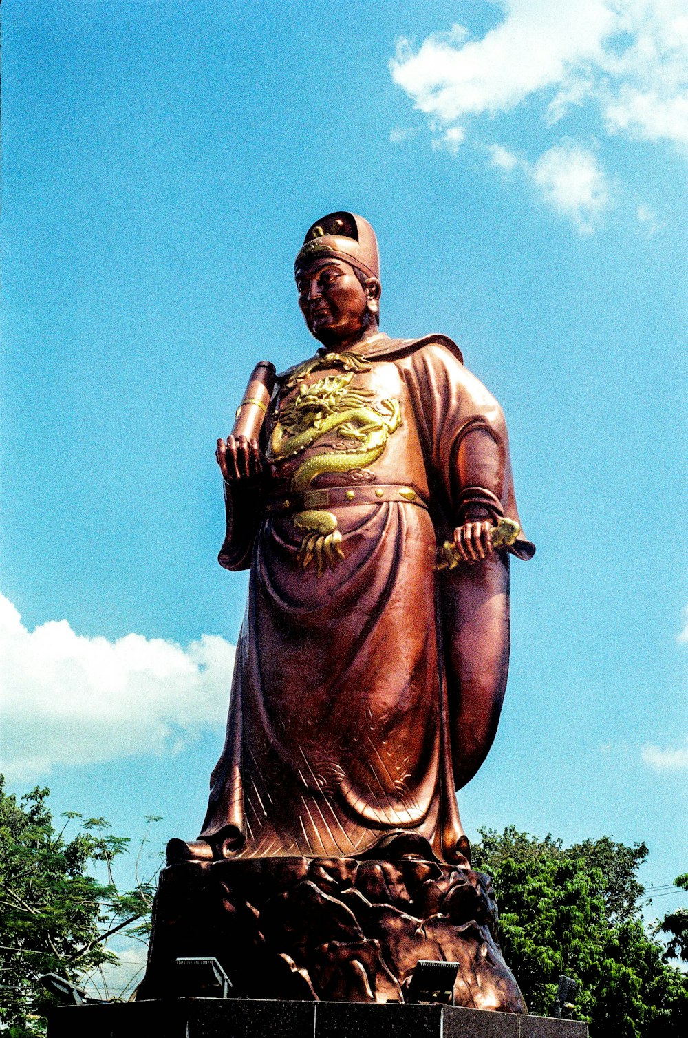 a large statue of a person with a hat on