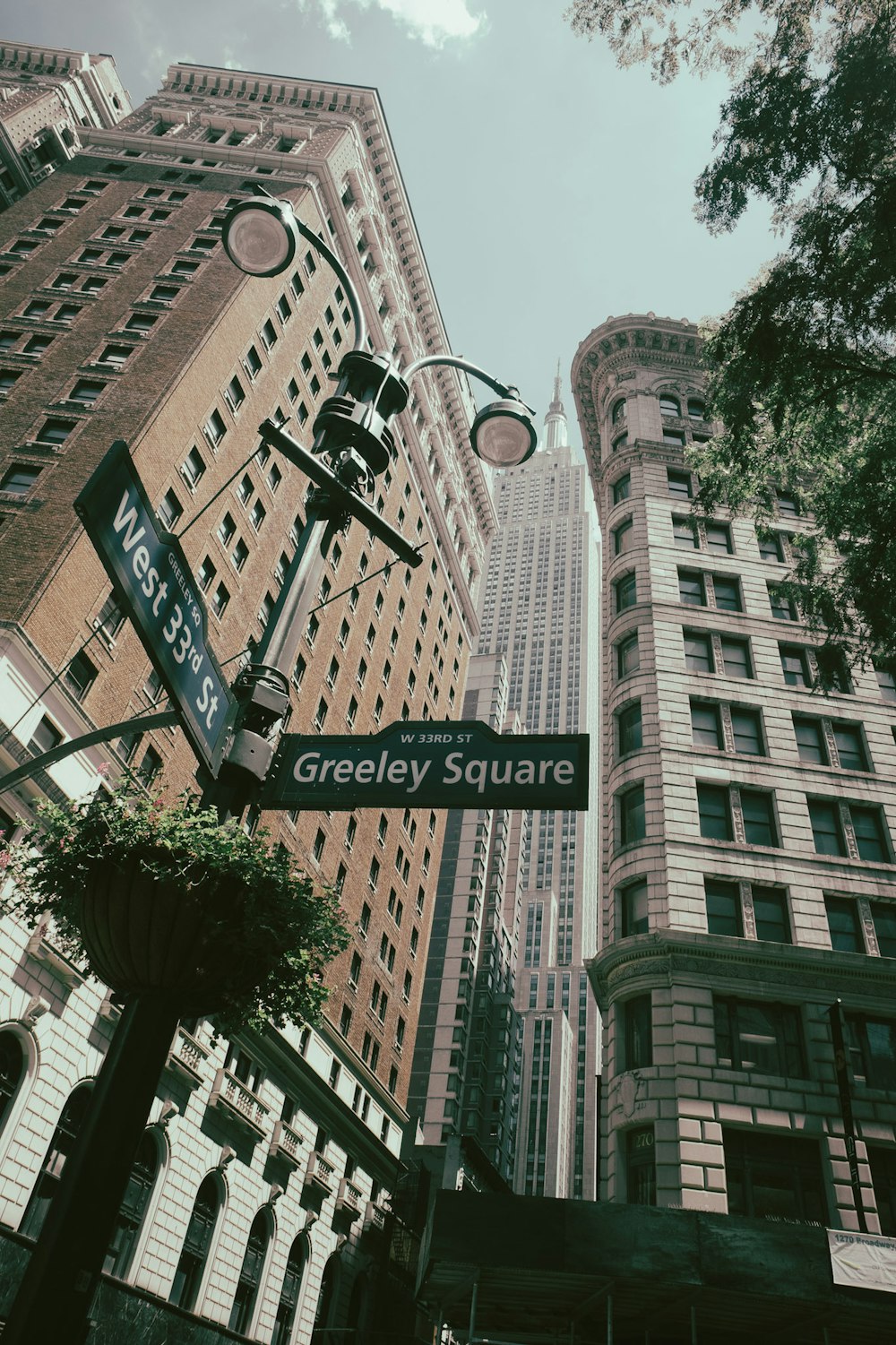 a street sign in front of a tall building