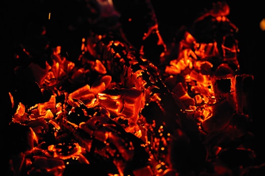 a close up of a fire in the dark