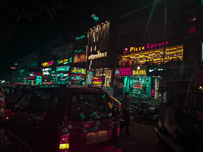 A vibrant storefront of Domino's Pizza in a busy Noida commercial area.