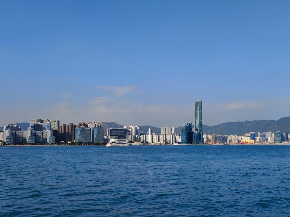 a large body of water with a city in the background