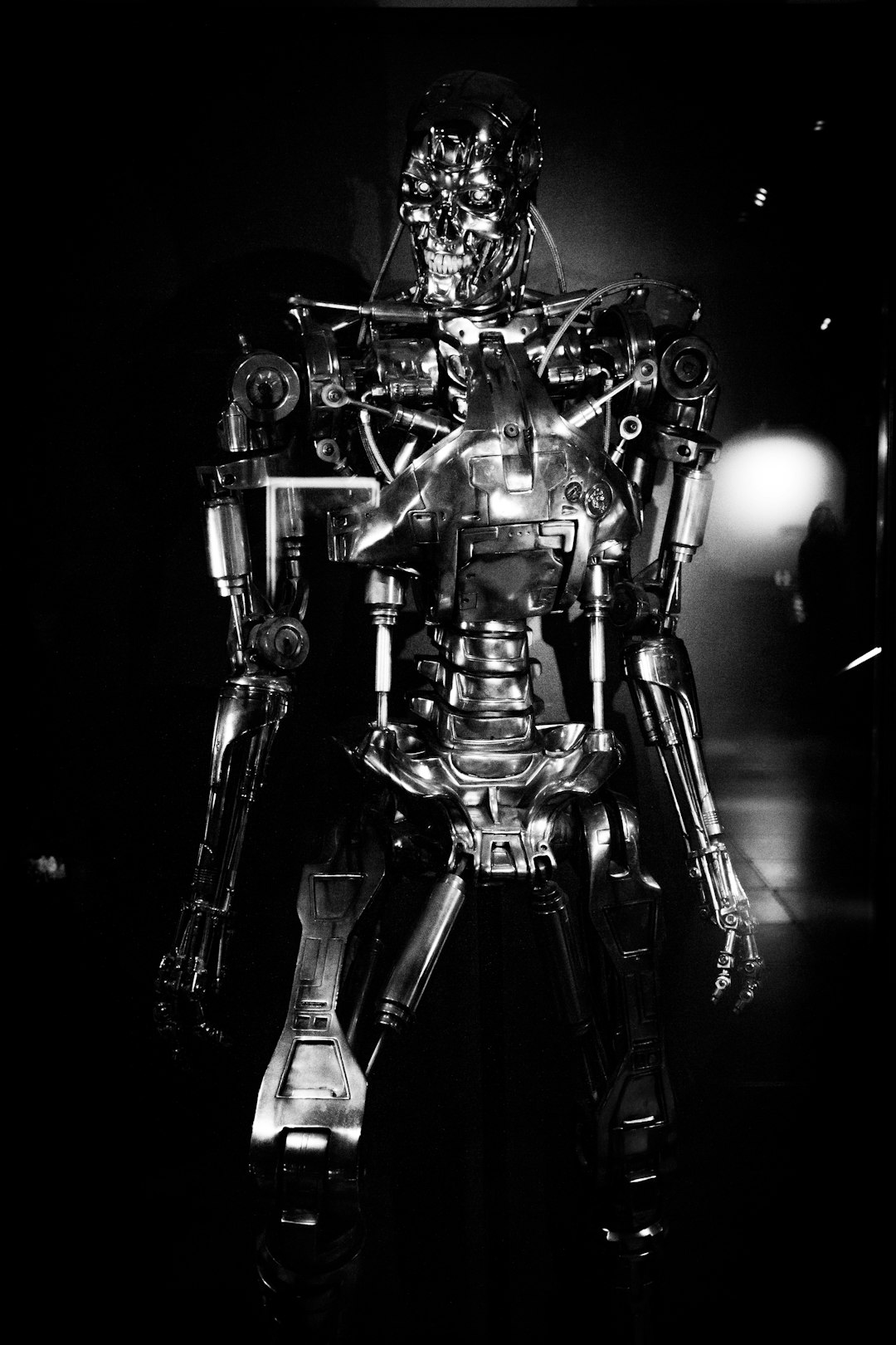 a black and white photo of a robot