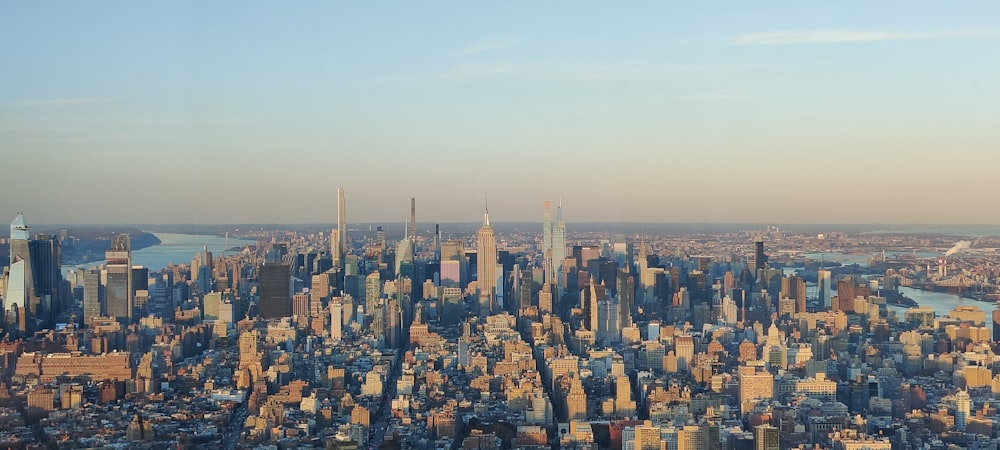 an aerial view of a city with tall buildings