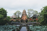 a large building surrounded by trees and plants