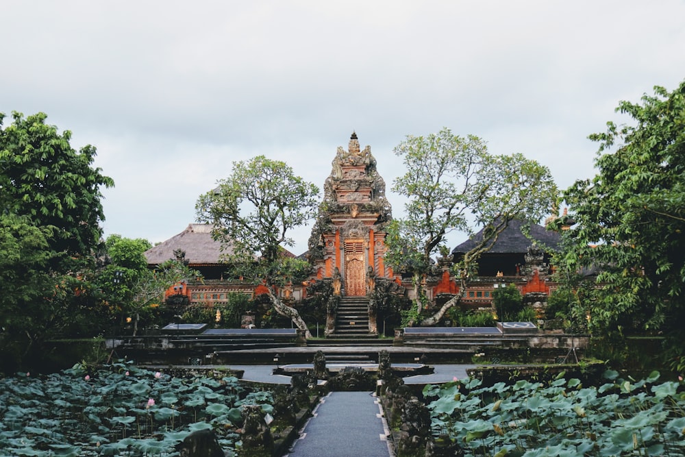 a large building surrounded by trees and plants