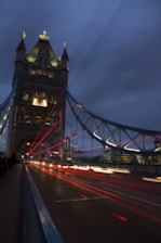 a long exposure shot of a bridge at night