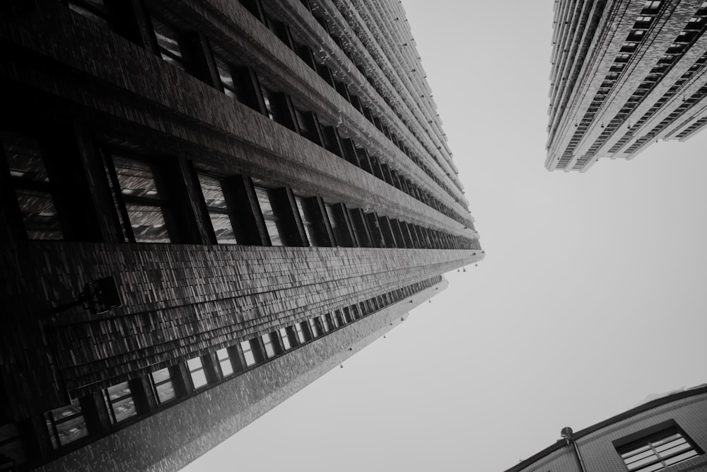 a black and white photo of two tall buildings