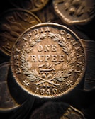 A rare 19th-century Indian rupee with delicate engravings and patina.