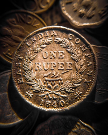 A rare 19th-century Indian rupee with delicate engravings and patina.