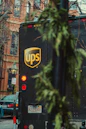 a ups bus parked on the side of the road