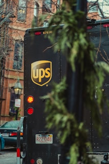 a ups bus parked on the side of the road