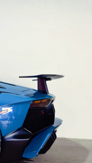 Rear view of a matte gray Camaro fitted with a rear diffuser and spoiler, highlighting clean aerodynamic lines