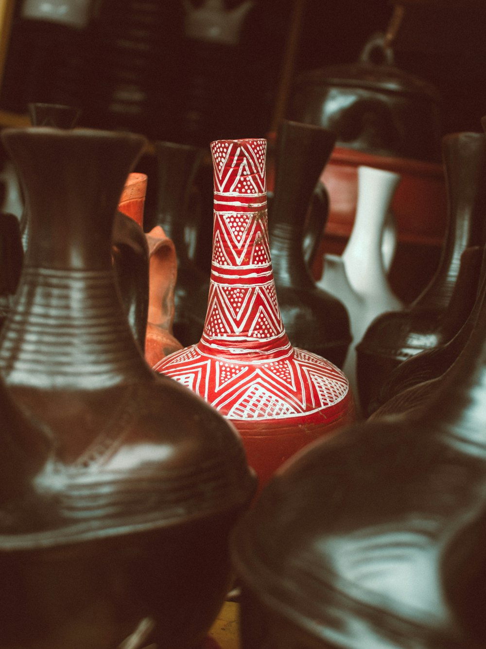 a group of vases sitting on top of a table