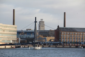 a boat in a body of water near a city