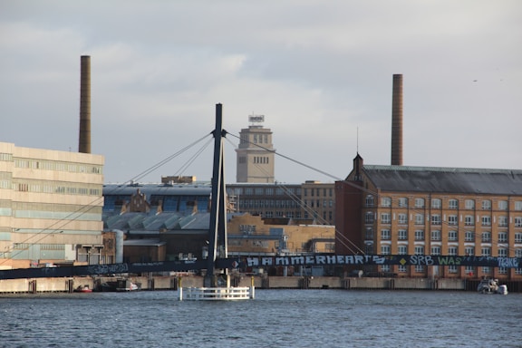 a boat in a body of water near a city