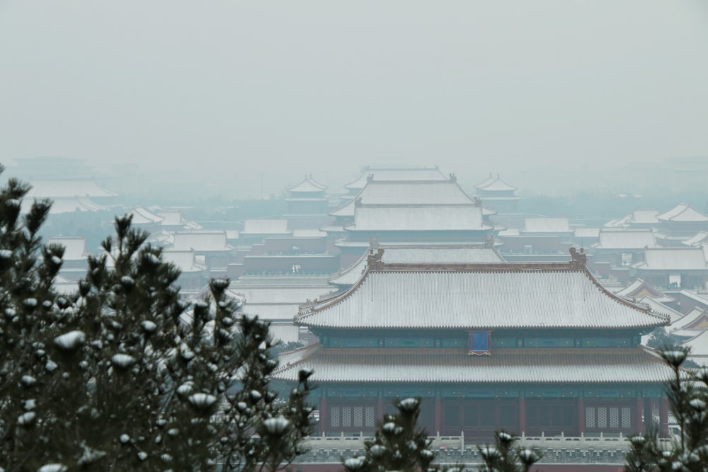 a view of a chinese building in the snow