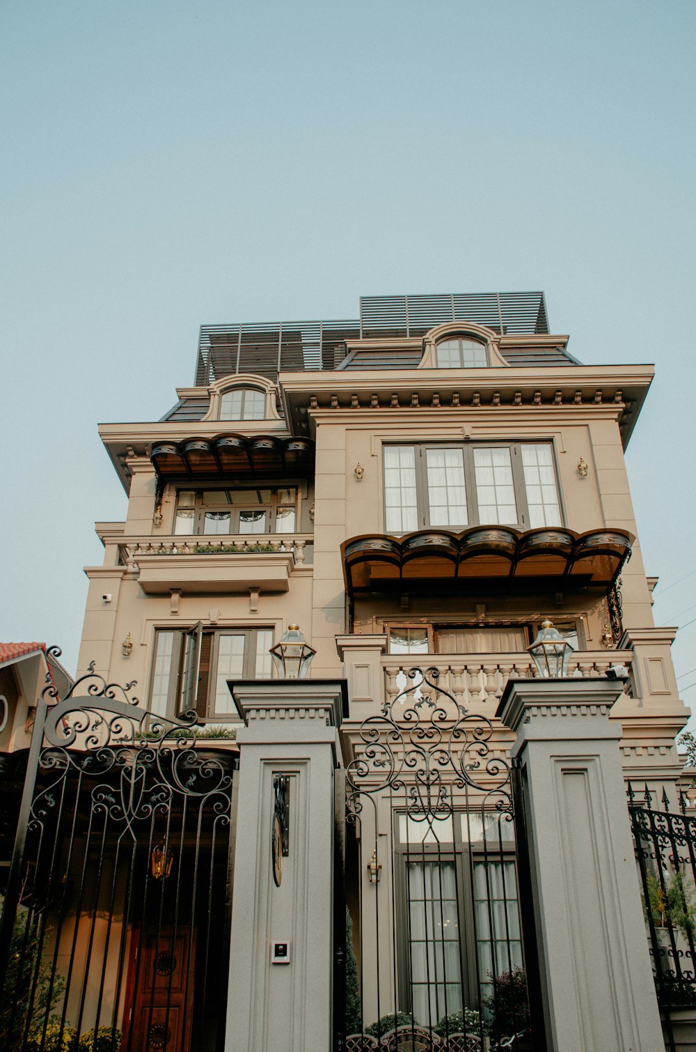 a tall building with a gate in front of it