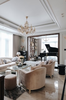 a living room filled with furniture and a piano
