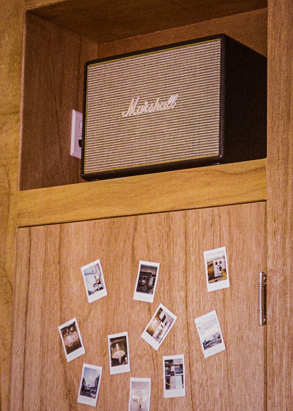 a wooden cabinet with a radio on top of it