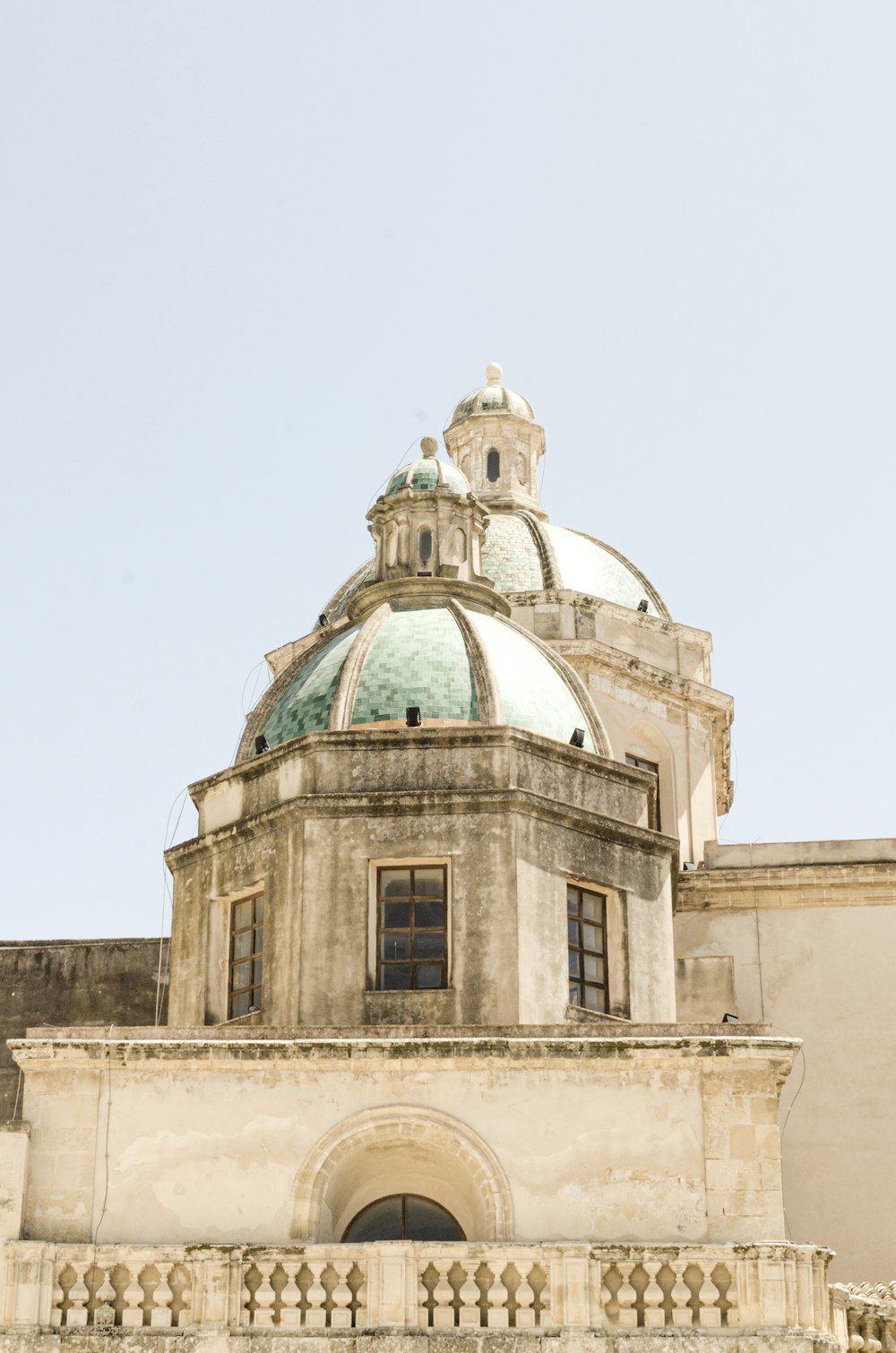 a large building with a clock on the top of it