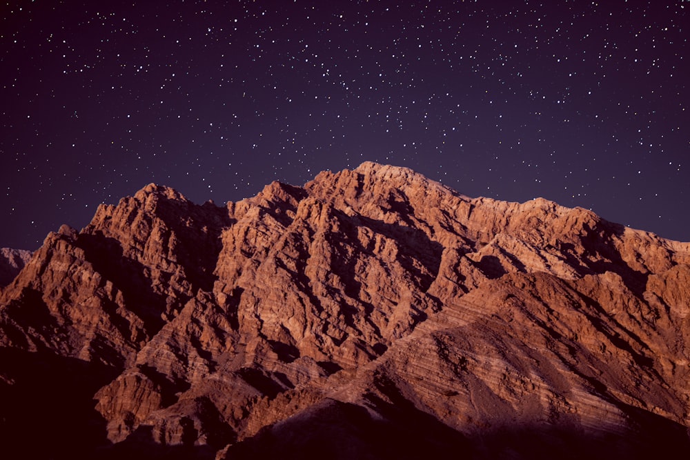 a mountain range with stars in the sky