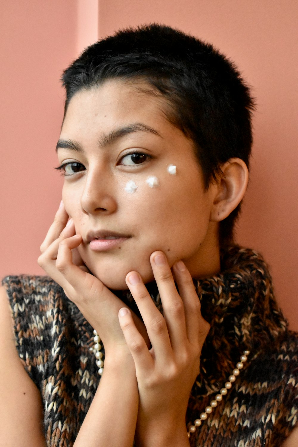 a woman with a white spot on her face