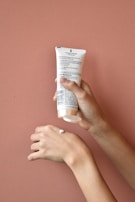 Texture shot showing the creamy, non-greasy formula spread on a hand.