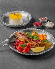A beautifully plated traditional Emirati dinner spread with colorful dishes and aromatic spices.