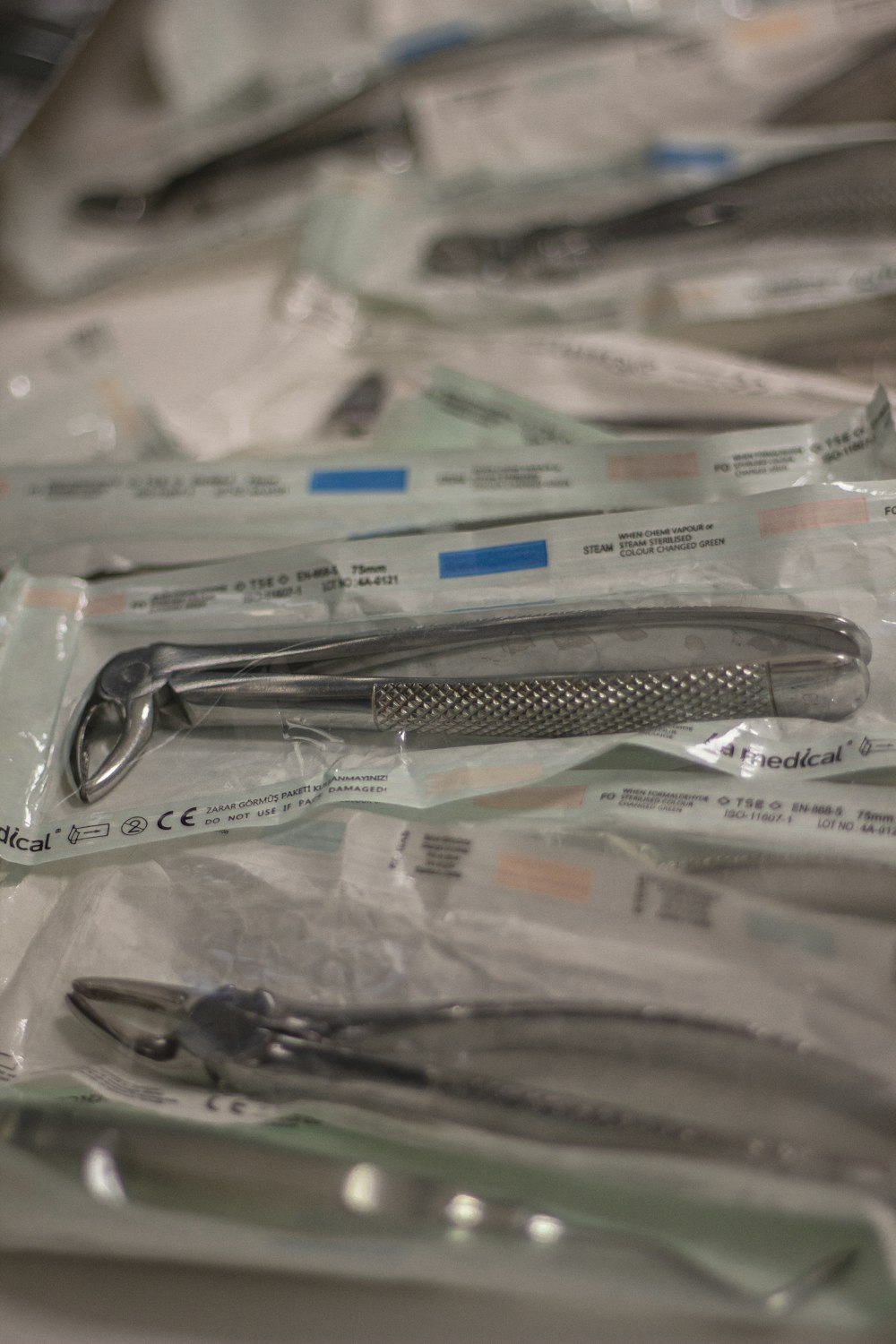 a bunch of surgical instruments are in plastic bags