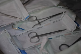 a pair of scissors and a pair of scissors on a table