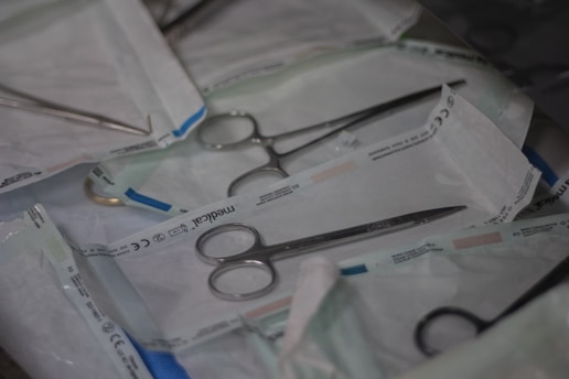 a pair of scissors and a pair of scissors on a table
