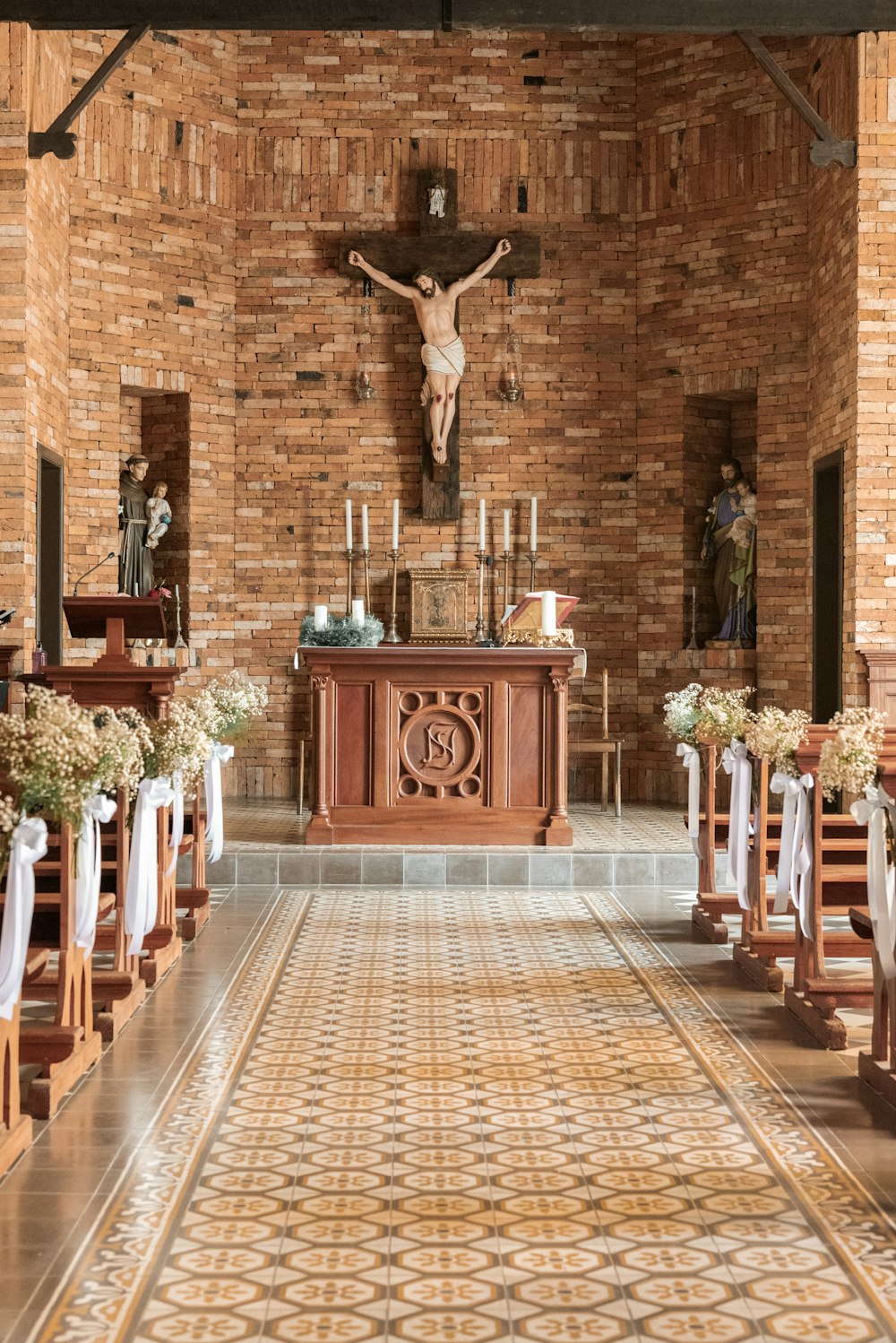 a church with a statue of jesus on the wall