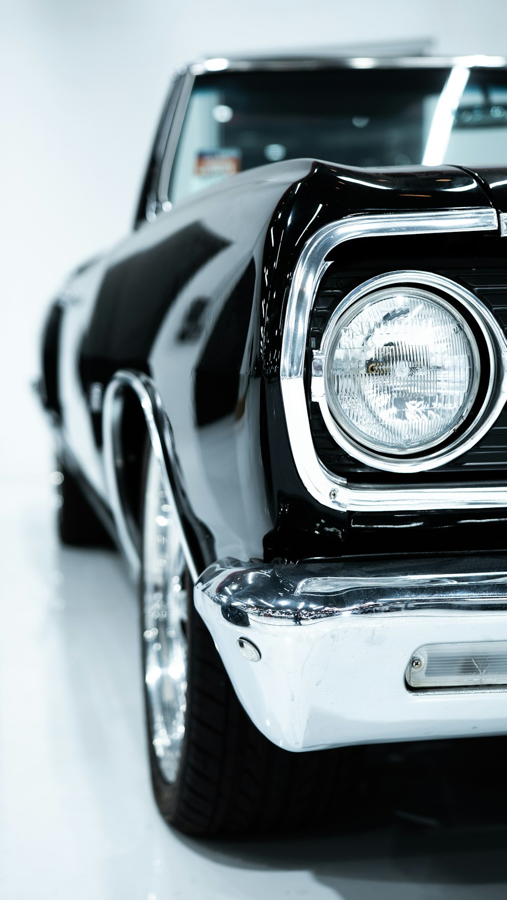 a black and white photo of a classic car