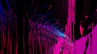 An abstract digital artwork featuring vibrant streaks and splashes of pink, blue, and purple against a predominantly black background. The pattern resembles a chaotic yet structured accumulation of vertical lines and scattered pixels, creating a vivid sense of movement and depth.