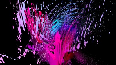 An abstract digital artwork featuring dynamic streaks and blocks of bright colors, predominantly pink and blue, emerging against a black background. The composition gives a sense of movement and fragmentation, with pixel-like patterns creating a vibrant and energetic visual effect.