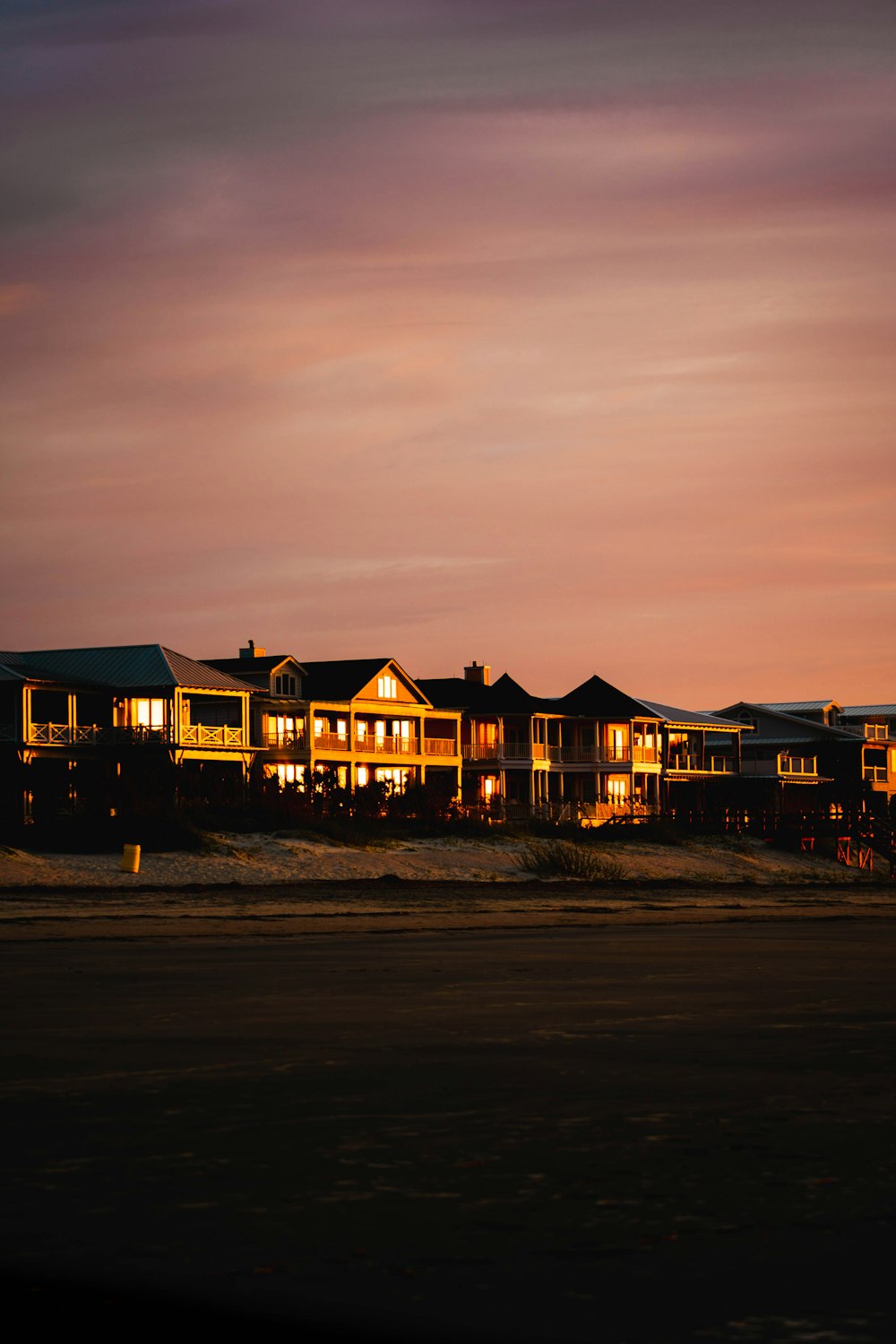 a row of houses lit up at night