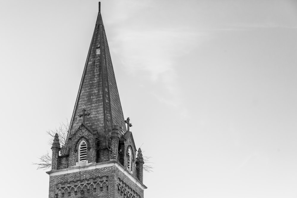 a black and white photo of a church steeple